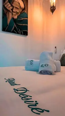 a bed with two towels on top of it at Private - Riad Désiré Marrakech in Marrakech