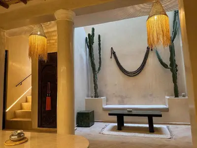 a living room with a couch and a table at Riad Keke 4 suites - Pool&Rooftop - Bahia in Marrakech