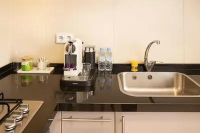 a kitchen with a sink and a counter top at Sophisticated & Cozy Home in Vibrant Marrakech in Marrakech