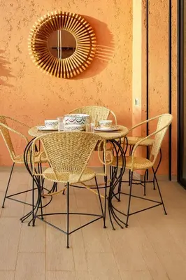 a dining room table with chairs and a mirror at Sophisticated & Cozy Home in Vibrant Marrakech in Marrakech