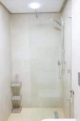 a bathroom with a shower and a toilet and a sink at Sophisticated & Cozy Home in Vibrant Marrakech in Marrakech