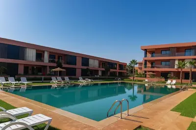 a large swimming pool in front of a building at Sophisticated & Cozy Home in Vibrant Marrakech in Marrakech
