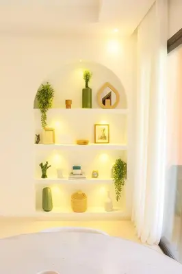 a bathroom with white shelves and a tub at 2 chambres avec terrasse vue piscine in Marrakech