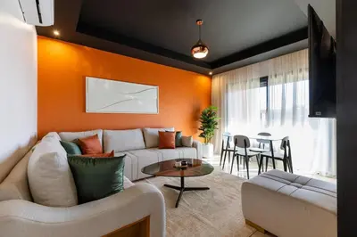 a living room with a couch and a table at Atlas Luxury Escape Golf Noria Pool & Quiet in Marrakech