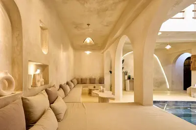 a living room with a couch and a table at Luxury Private Riad - Pool - Breakfast Included in Marrakech