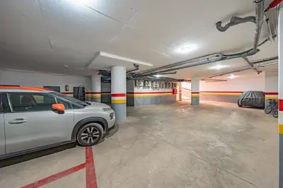 a parking garage with a car parked in it at Charming apartment in the center of Victor Hugo Gueliz in Marrakech