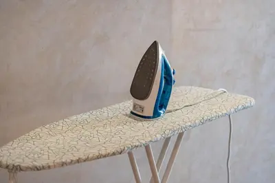 a iron sitting on top of a chair at Charming apartment in the center of Victor Hugo Gueliz in Marrakech