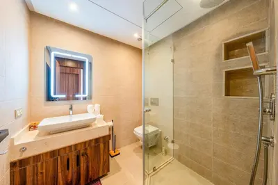 a bathroom with a sink and a toilet and a shower at Charming apartment in the center of Victor Hugo Gueliz in Marrakech