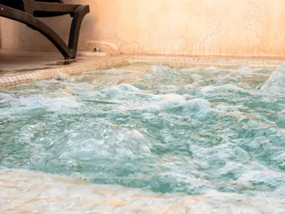 a large jacuzzi tub with water in it at Riad Jebly - Exclusive -Jacuzzi & Breakfast ,10 min walk Jemaa El Fnaa - Panoramic View Rooftop in Marrakech