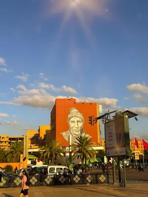a building with a mural of a man with a hat at Stylish 2-bed flat in Marrakech city center - steps from train station in Marrakech