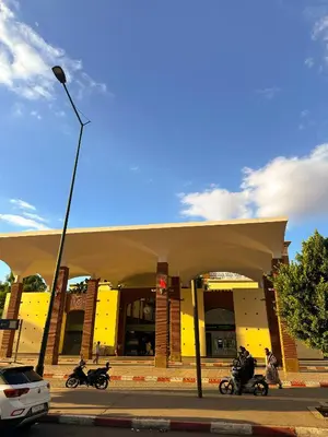 a building with motorcycles parked in front of it at Stylish 2-bed flat in Marrakech city center - steps from train station in Marrakech