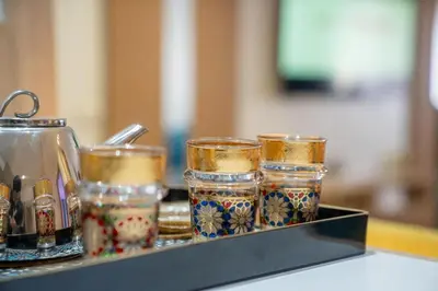 a group of glass jars sitting on a shelf at CAN 2025 - T2 design Gare de Marrakech - Guéliz-Hivernage - WiFi in Marrakech