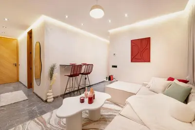 a living room with a white couch and a table at Cocooning escape Relaxation, design and serenity in Marrakech