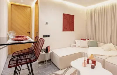 a small living room with a bed and a couch at Cocooning escape Relaxation, design and serenity in Marrakech