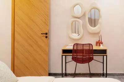 a room with a table and a chair next to a door at Cocooning escape Relaxation, design and serenity in Marrakech