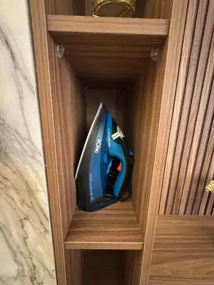 a blue and black appliance in a wooden drawer at Urban Studio Guéliz in Marrakech