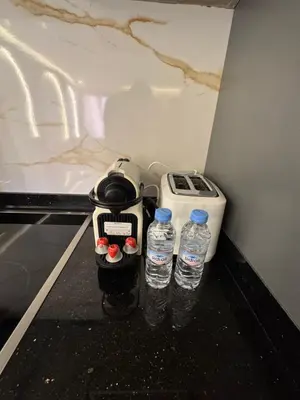 two bottles of water sitting next to a blender at Urban Studio Guéliz in Marrakech