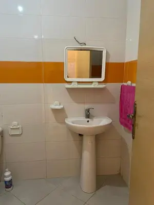 a bathroom with a sink and a mirror on the wall at Abwab guiliz in Marrakech