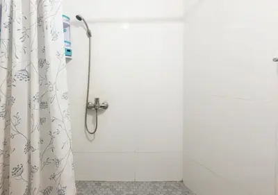 a shower stall with a shower curtain in a bathroom at Appart Jamaa lafna square in Marrakech