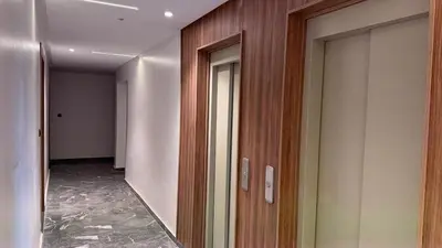 a hallway of an office building with a mirror at Mosaic 54 - Terrasse & Piscine chauffée - M Avenue in Marrakech