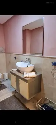 a bathroom with a sink and a mirror at Nilia in Marrakech