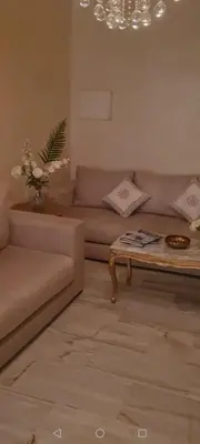 a living room with a couch and a coffee table at Nilia in Marrakech