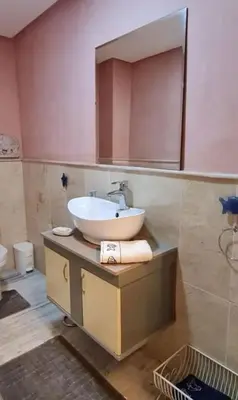 a bathroom with a sink and a mirror at Nilia in Marrakech