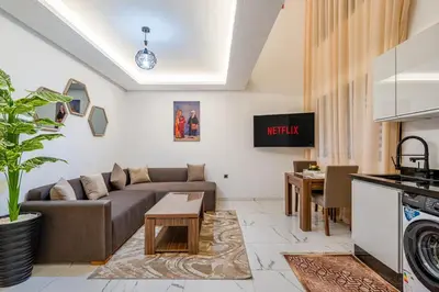 a living room with a couch and a table at Guéliz 7 Appartements in One Building in Marrakech