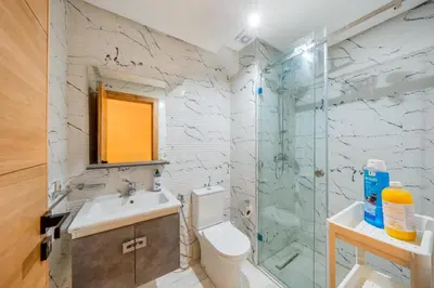 a bathroom with a sink toilet and a shower at Guéliz 7 Appartements in One Building in Marrakech