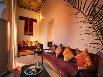 a living room with a couch and a table at Riad Darhani - Private use option - in Marrakech