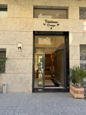 a entrance to a building with a glass door at Appartement duplex haut standing Guelyz in Marrakech