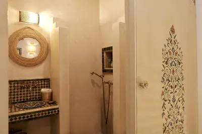 a bathroom with a shower and a mirror at Riad Beata - Private use option - in Marrakech
