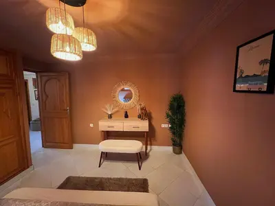 a room with a dressing table and a mirror at Le Patio Marrakchi in Marrakech