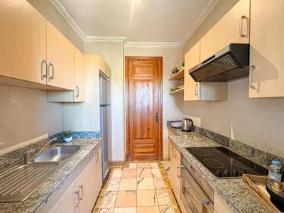 a kitchen with a sink and a counter top at Oasis Palmeraie - Piscines & terrasses in Marrakech