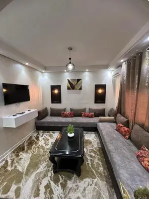 a large living room with a couch and a table at Cocon Chic et Élégant Quartier Hivernage in Marrakech