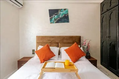 a bedroom with a bed with a tray on it at Cocon Chic et Élégant Quartier Hivernage in Marrakech