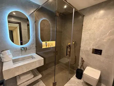 a bathroom with a shower and a sink and a toilet at Modern apartment in Gueliz Plaza in Marrakech