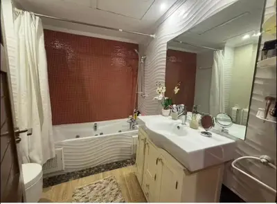 a bathroom with a sink and a tub and a toilet at Moroccan style Soltana pool & central internet in Marrakech