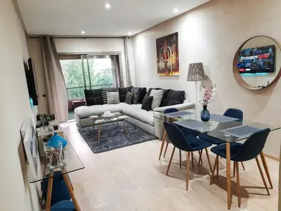 a living room with a couch and a table at Luxury Apartments in Marrakech