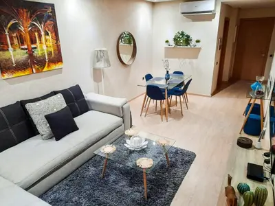 a living room with a couch and a table at Luxury Apartments in Marrakech