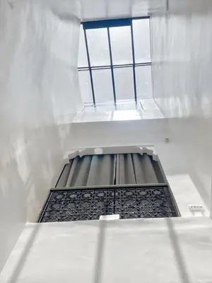 a stair case with a window in a building at Riad coup de coeur, Medina, Marrakech in Marrakech