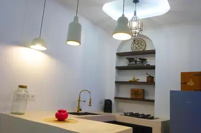 a kitchen with pendant lights and a counter top at Little date in Marrakech
