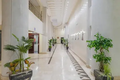 an empty hallway with potted plants in a building at Secure Stylish Flat Gueliz Pool WiFi Parking in Marrakech