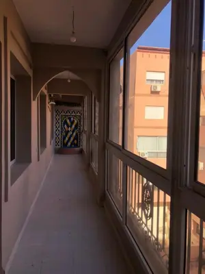a hallway of a building with large windows at Majorelle louza in Marrakech