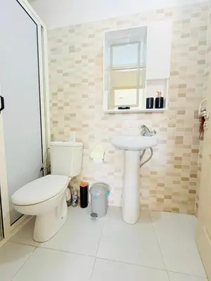 a bathroom with a toilet and a sink at TheCosyCorner in Marrakech