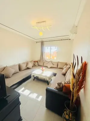 a living room with a couch and a table at TheCosyCorner in Marrakech