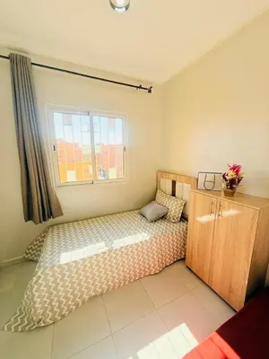 a bedroom with a bed and a window at TheCosyCorner in Marrakech