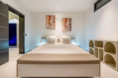 a bedroom with a large bed in a room at Modern Golf Retreat Heated Pool & Free breakfast in Marrakech