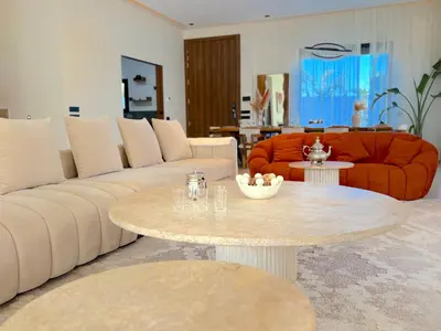 a living room with a couch and a table at Palais Naya in Marrakech