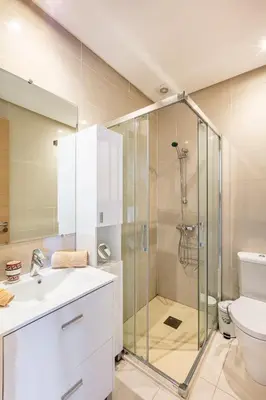 a bathroom with a shower and a sink and a toilet at Golf View Escape in Oulad Akkou